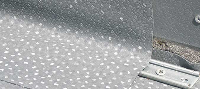 What is a single-ply flat roofing membrane?